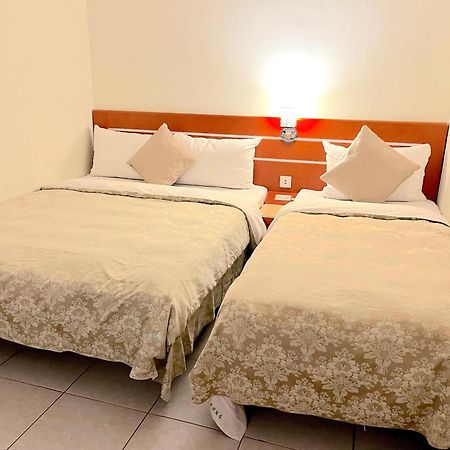 Hua Guo Hotel Цзилун Номер фото