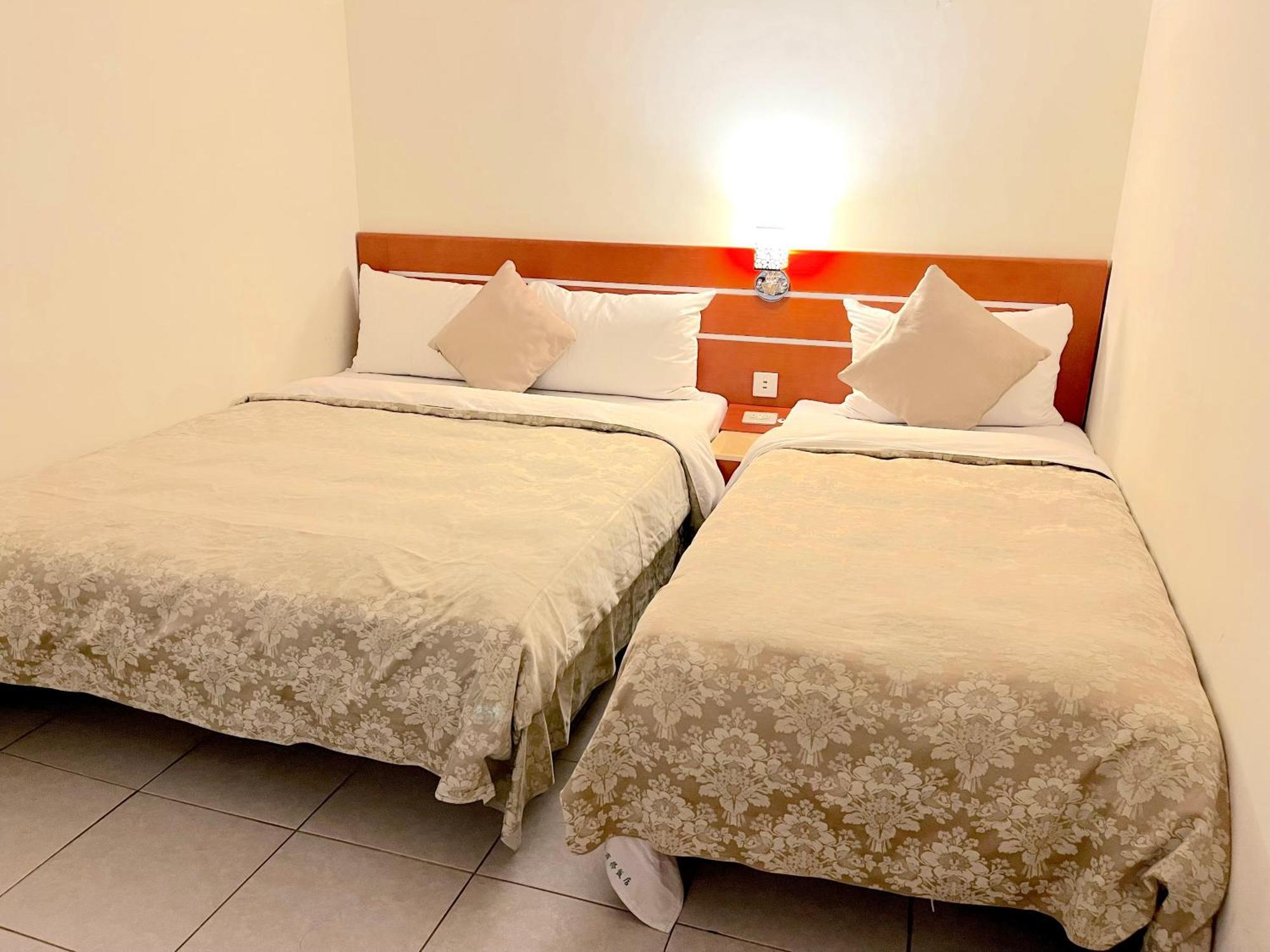 Hua Guo Hotel Цзилун Номер фото