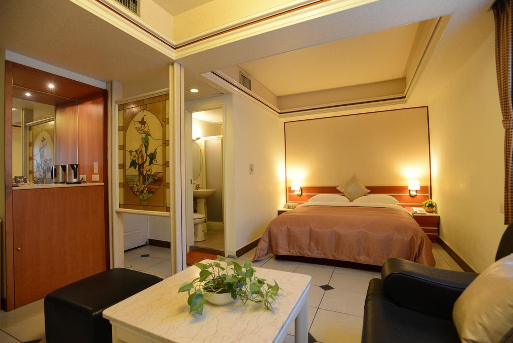 Hua Guo Hotel Цзилун Номер фото