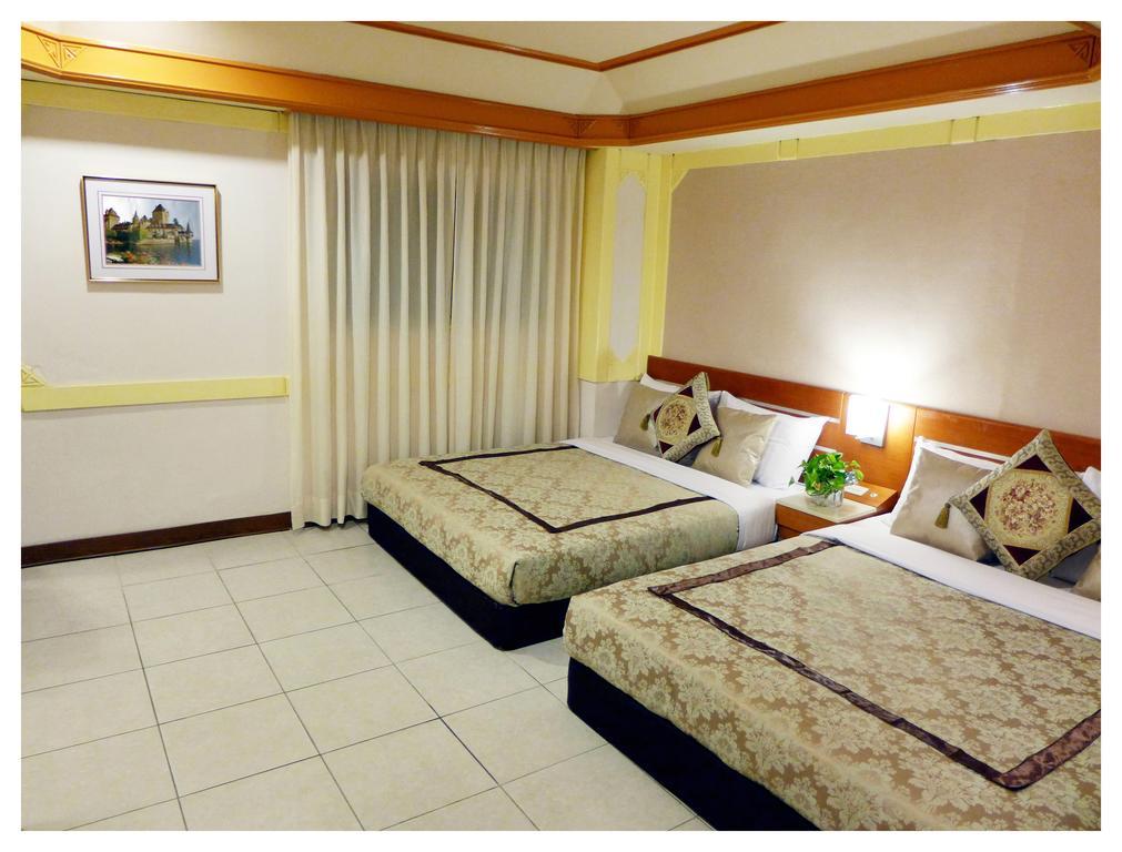 Hua Guo Hotel Цзилун Номер фото
